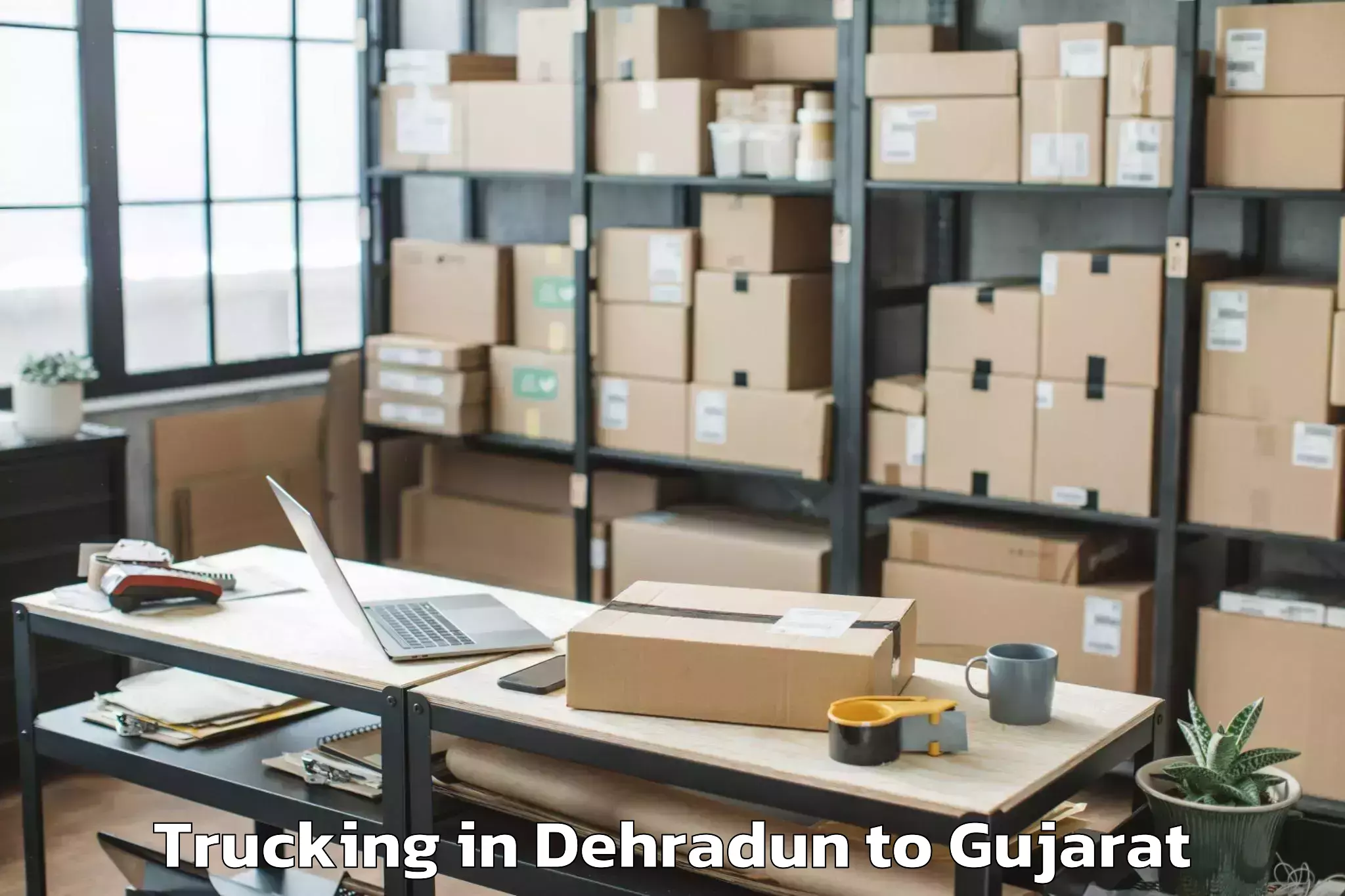 Top Dehradun to Dehgam Trucking Available